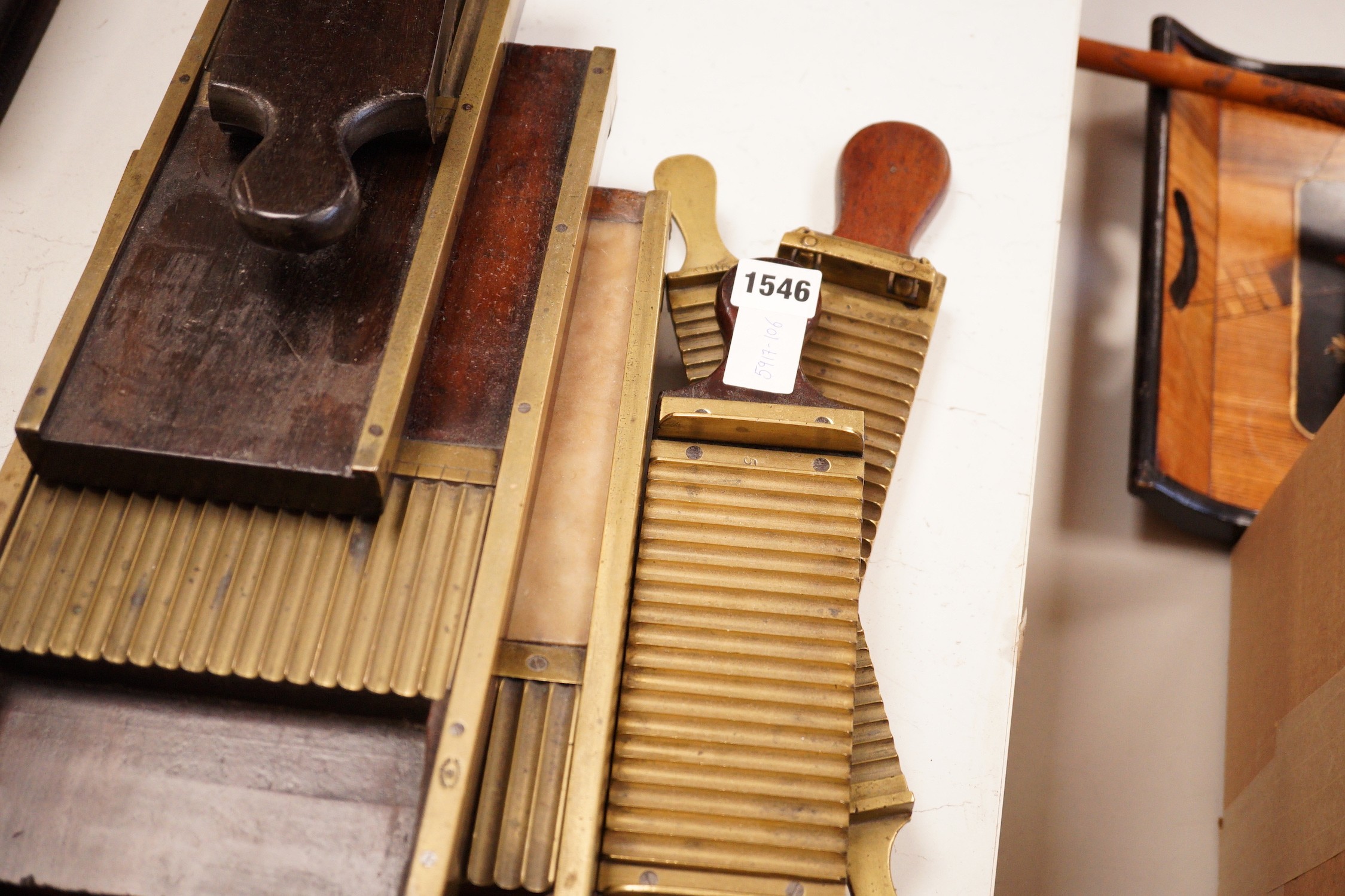 A collection of 19th century brass and mahogany chemist’s pill press rollers, Drury Lane marked examples etc